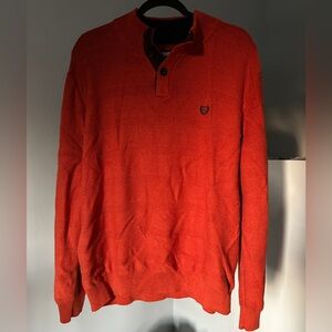 Step up your sweater game with this CHAPS men’s sweater in a vibrant orange/red.